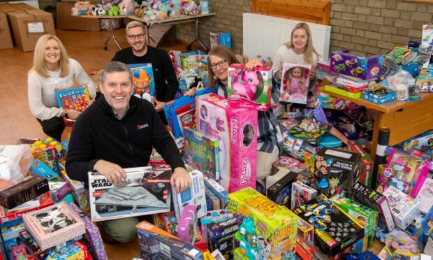 St George's Church, on Hayton Road in Aberdeen has been turned into a gift wrapping factory as Christmas approaches. 
Volunteers, from left, Donna Ferguson, Paul Henderson, Garry Sturrock, Susan Cheyne and Rachael Noble. Image: Kath Flannery/ DC Thomson.