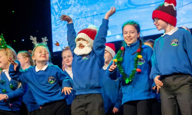 Santa hats, beards and reindeer antlers and killer dance moves: Insch Primary and the 2022 Evening Express Christmas Concert had it all. Image: Kath Flannery / DC Thomson
