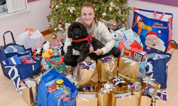 Amy Strath, pictured with her dog Harry, has donated more than 350 gifts as part of the VSA's charity Christmas Appeal. Image: Kath Flannery/DC Thomson.