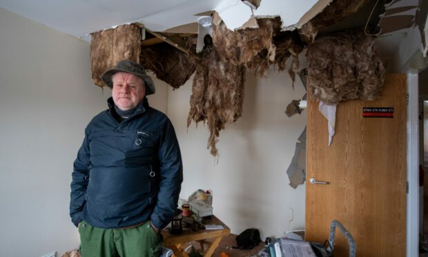 Michael Bardill at his home in Insch, after water flooded through the ceiling. Image: Kami Thomson/DC Thomson