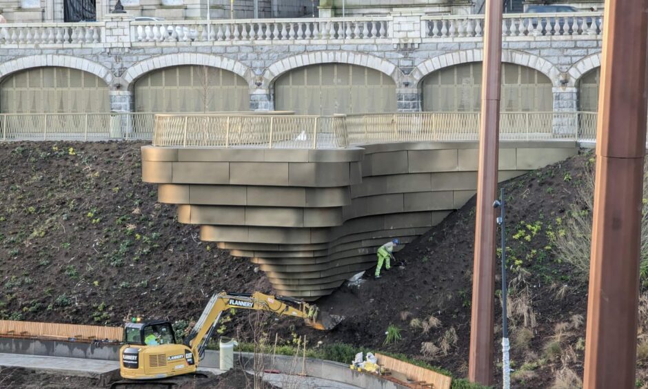 Work continues around the cladding of one of the new walkways in Union Terrace Gardens. Council chiefs want to open UTG within the next four days. Image: Alastair Gossip/DCT Media. December 20 2022.