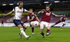 Tottenham Hotspur's Harry Kane (left) and Burnley's Kevin Long battle for the ball. Image: PA