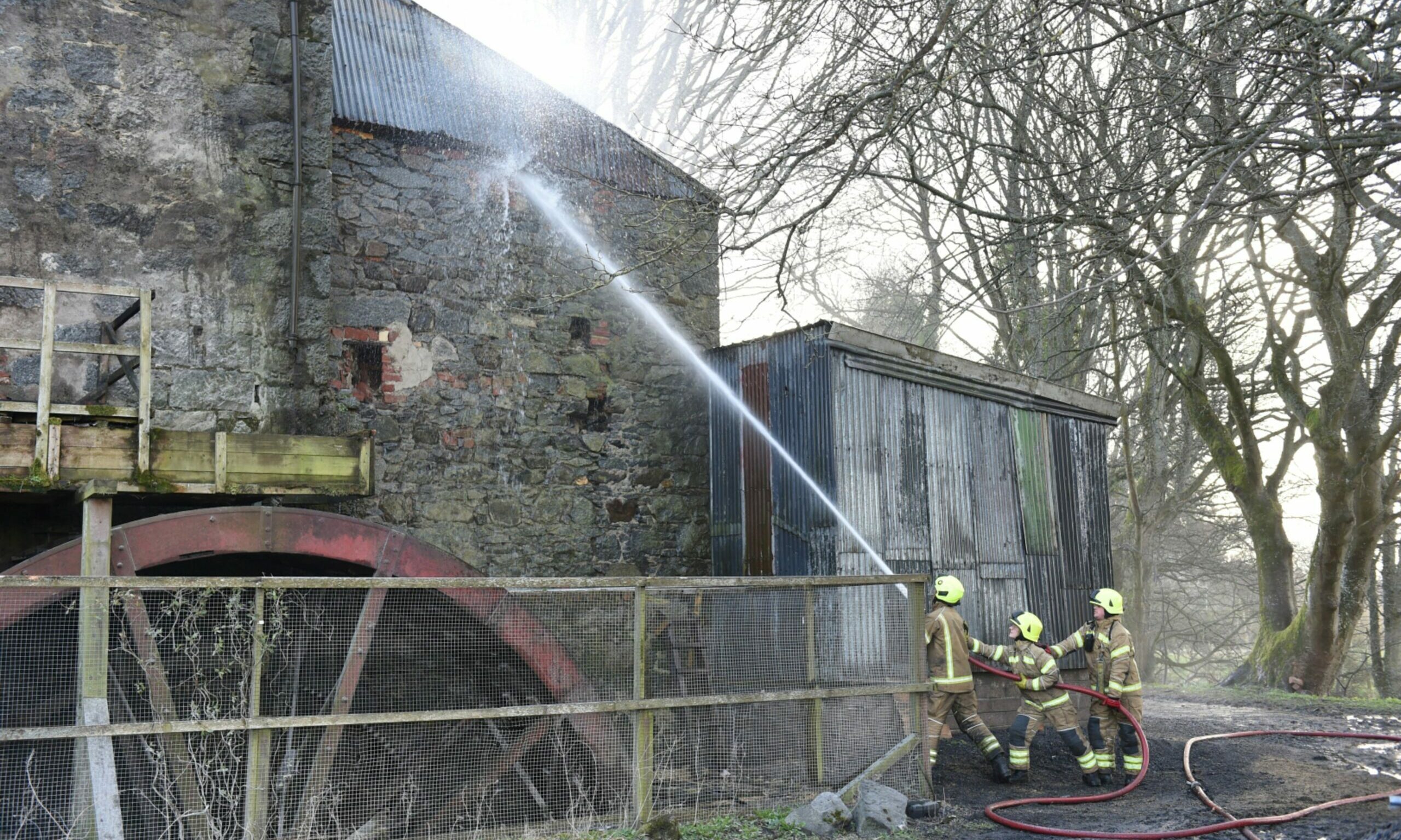 The water wheel seen here as firefighters battle the 2020 blaze.