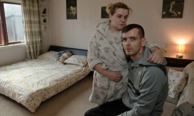 Jade Simpson and Gavin McPhee in their home which has been flooded with raw sewage on several occasions.
Image: Sandy McCook/DC Thomson
