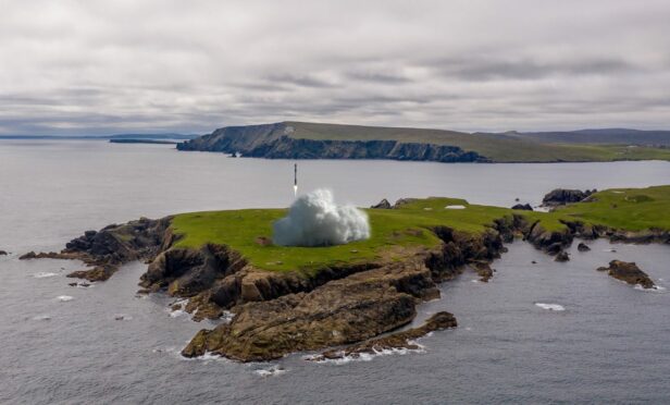 Image of SaxaVord Spaceport featuring a mock rocket taking off from the site on Lamba Ness in Unst .