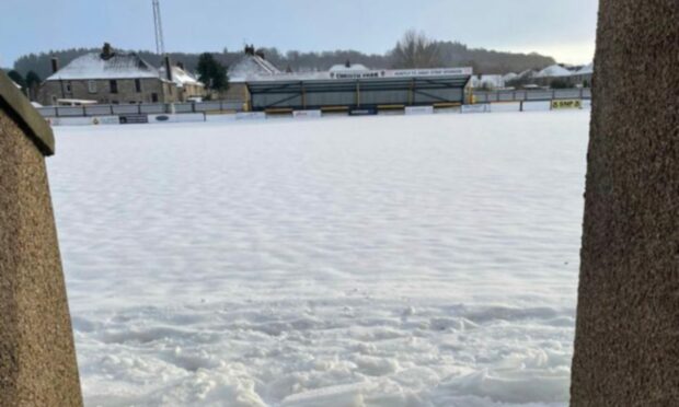 The scene at Huntly's Christie Park yesterday with snow covering the pitch and forcing today's game to be postponed