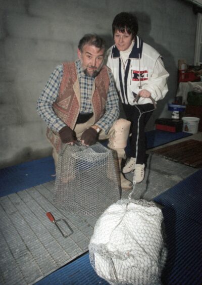 Bill Emslie with his daughter Lynn Callaghan are seen here in 1996 preparing their fire balls.