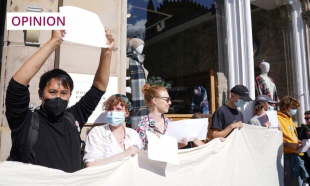 In 2022, demonstrators staged a silent protest with blank placards in Edinburgh to make a statement about freedom of speech (Image: Stuart Wallace/Shutterstock)