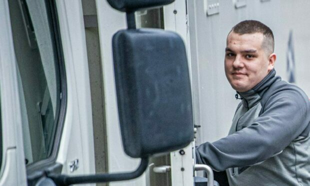 Kyle McMillan being taken back to jail from Aberdeen Sheriff Court. Image: Wullie Marr/DC Thomson