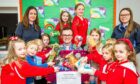 Rainbows in Pitmedden worked hard to collect for the Big Christmas Food Appeal. 
Image: Wullie Marr / DC Thomson