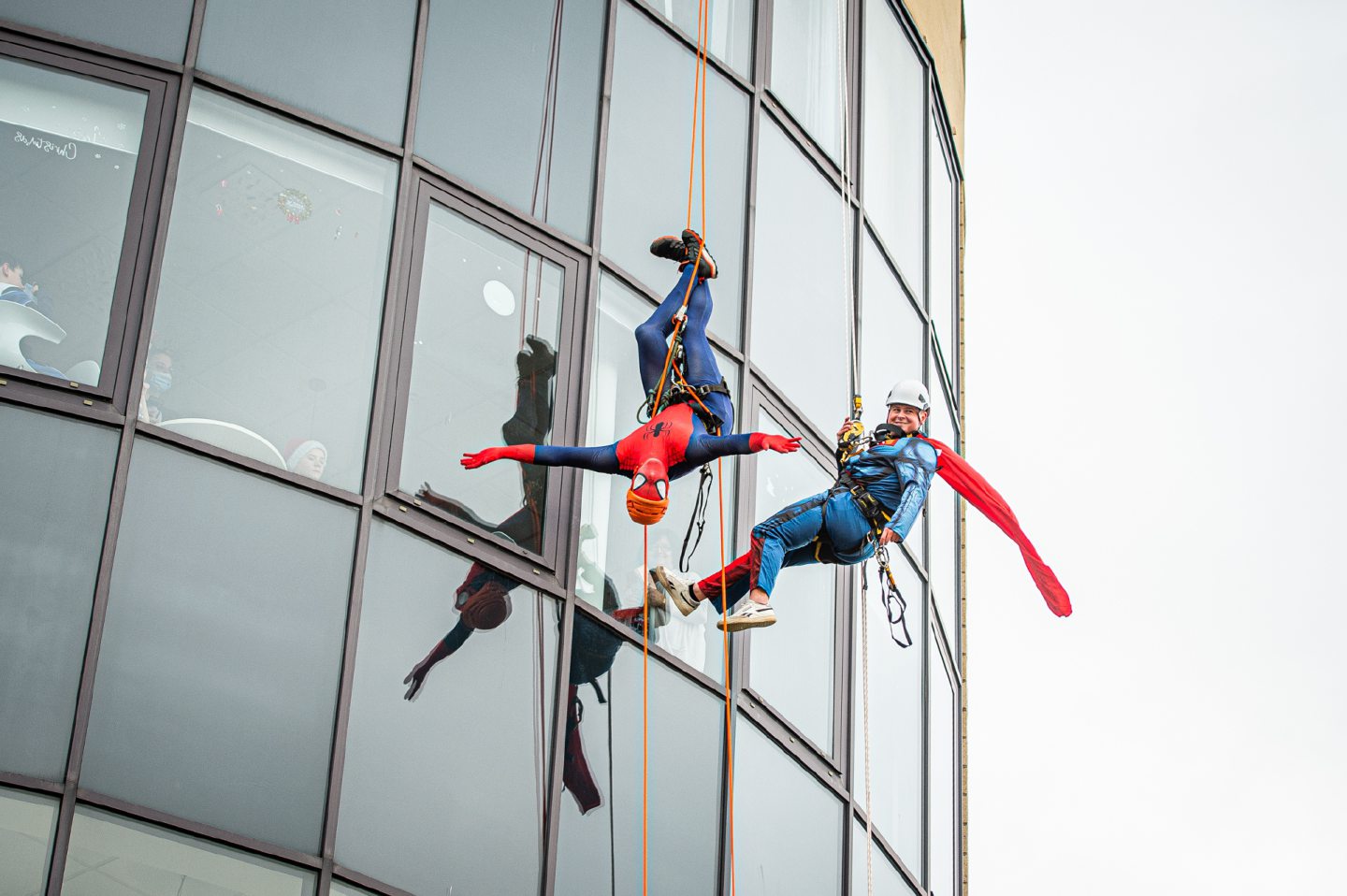 Aerial acrobatics: Spider-Man and Superman take the scenic route as they abseil down Royal Aberdeen Children's Hospital. Image: Wullie Marr / DC Thomson