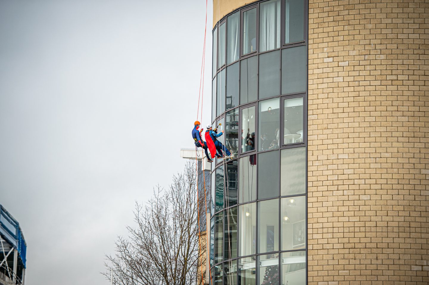 Descending down a wall of windows, Superman didn't need his X-ray vision to see the children inside. Image: Wullie Marr / DC Thomson