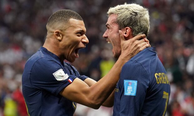 France's Kylian Mbappe and Antoine Griezmann celebrate their side's second goal against England. Image: PA.