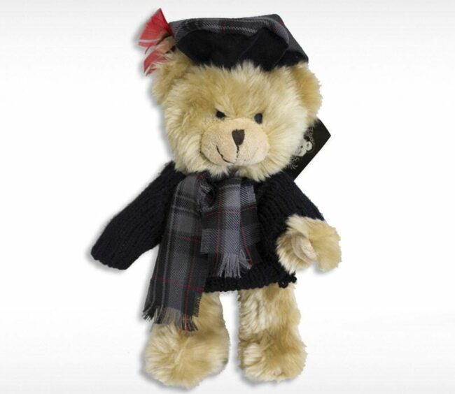A little plush teddy bear dressed in black that you can buy for the perfect Scottish Christmas gift.