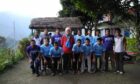 Derek Newton with village football team players in Nepal. Image: Derek Newton.