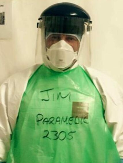James Moffat in PPE  during Ebola outbreak.