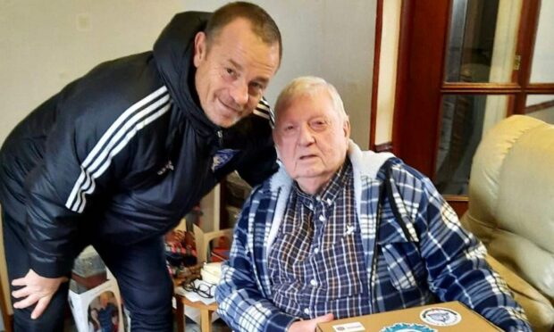 A hamper being donated to a man. Image: SPFL.