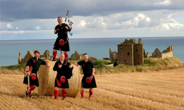 The Red Hot Chilli Pipers pictured at Dunnottar Castle. Image: Colin Rennie/ DC Thomson.