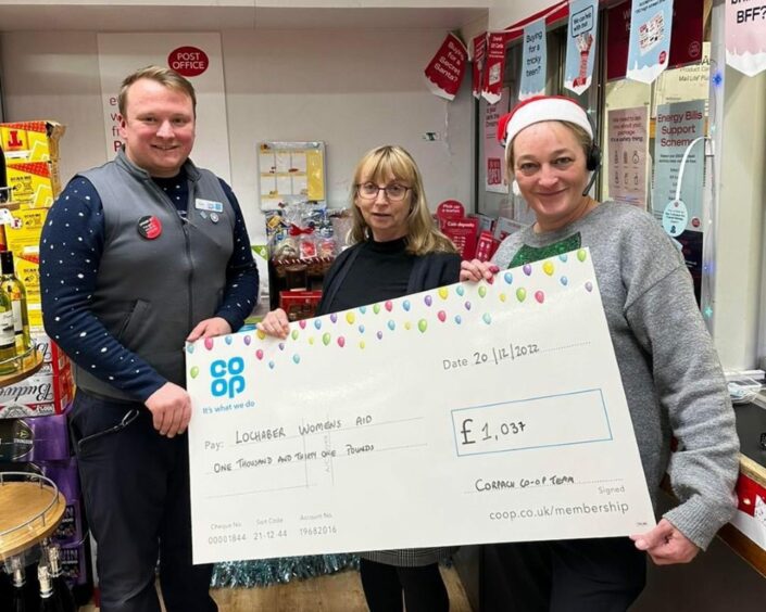 Lochaber Women's Aid Service Manager visited the Corpach Community Store to pick up a cheque of £1037 that they raised by running a raffle in their store