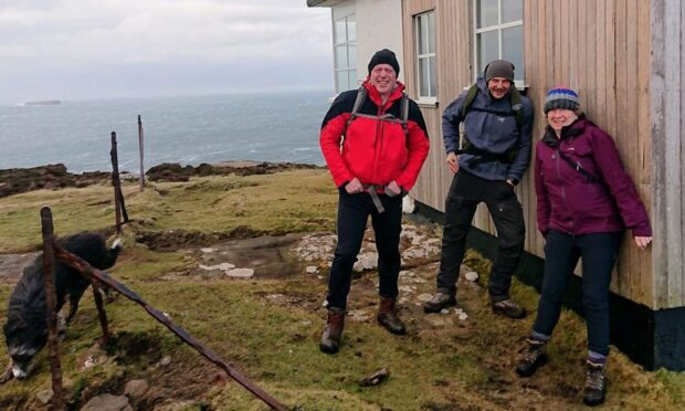 Ian Furlong (left) with two other MBA volunteers at a bothy on Skye. Image: Ian Furlong