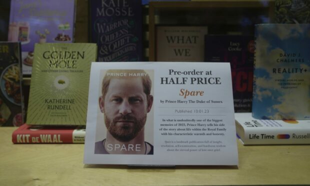 Promotional poster of the new book Spare is displayed in a bookstore in London. Image: Kin Cheung/AP/Shutterstock.