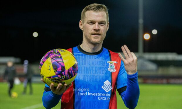 Billy Mckay with the matchball after scoring a hat-trick against Cove Rangers on Monday. Image: Ewan Bootman/SNS Group