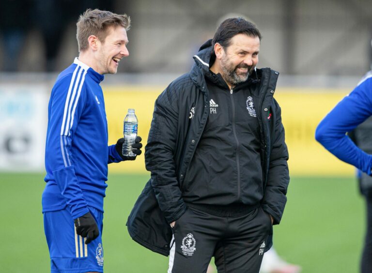 Cove Rangers' Blair Yule and manager Paul Hartley. Image: SNS