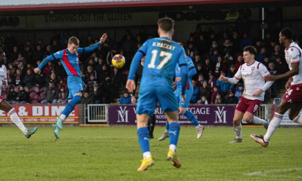 Jay Henderson steers his high shot into the net to give Inverness a 2-1 advantage at Arbroath. Images: Euan Cherry/SNS Group