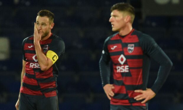Ross Callachan and Keith Watson look distraught following Ross County's 2-0 defeat to Livingston. Image: SNS