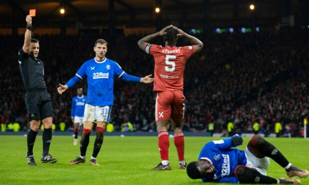 Referee Nick Walsh shows Aberdeen's Anthony Stewart a straight red card for a foul on Rangers' Fashion Sakala. at Hampden. Image: SNS