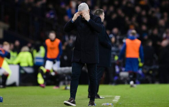 Aberdeen manager Jim Goodwin looks dejected during the League Cup semi-final defeat to Rangers. Image: SNS