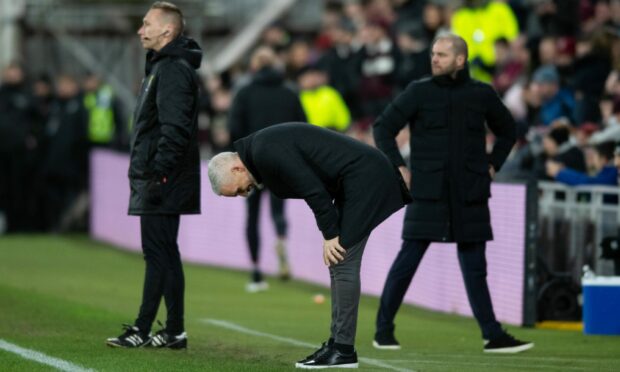 Aberdeen manager Jim Goodwin looks dejected in the 5-0 loss to Hearts.  (Photo by Mark Scates / SNS Group)