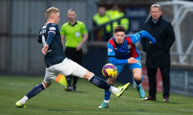 Inverness' Daniel MacKay skips past Raith's Ross Millen. Image: SNS