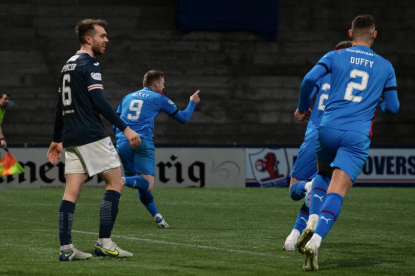 Billy Mckay wheels away after levelling for Caley Thistle. Image: SNS