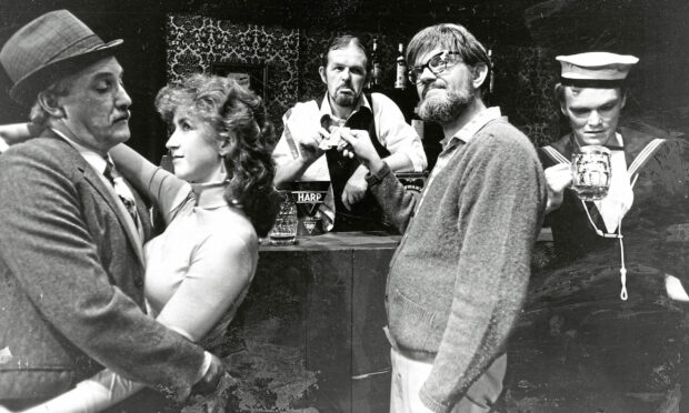 A scene from a Studio Theatre Group show, including a man buying a drink at a bar, a man and woman dancing and a sailor drinking