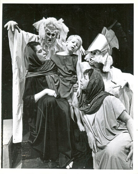 The cast of The Trojan Woman performing in costume