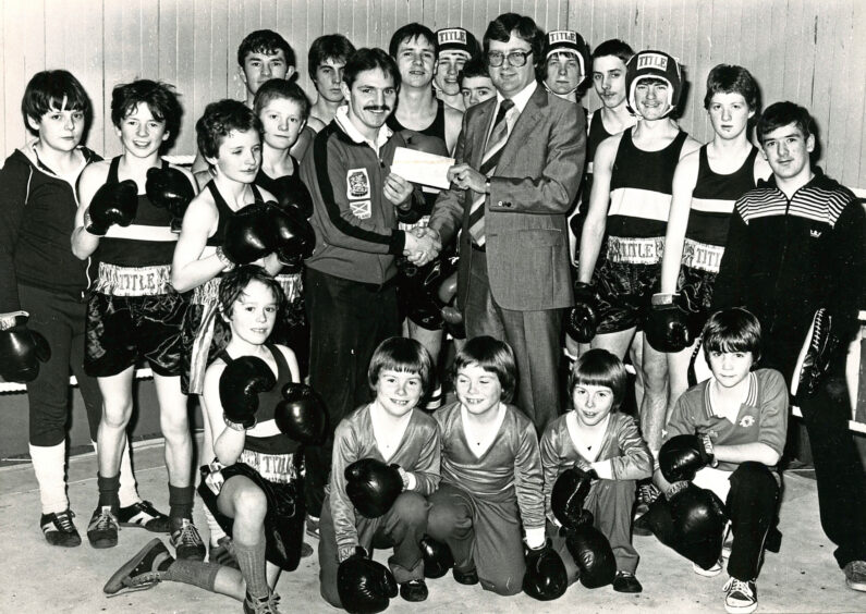 1981 - David Owens of Save and Prosper presents a cheque for £150 to Bridge of Don boxing club.