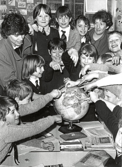 1988 - Pupils of Primary 4/1 point out geographical areas on the globe to parents at the Banchory Primary School open day.