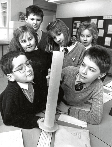 1989 - Pupils of Primary 4/1 point out geographical areas on the globe to parents at the Banchory Primary School open day.