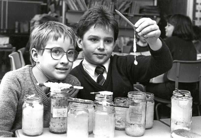 1989 - Primary 5(1) pupils Chris Sharples, right, and David Hughes, of Banchory Primary School, study the results of their crystal experiments.