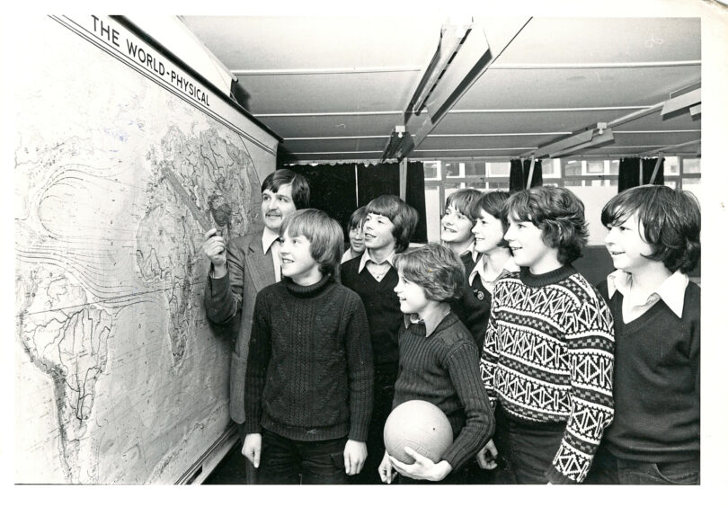 1979 - Principal geography teacher at Banchory Academy Neil Grant points to the Belgian destination the members of the school’s under-14 and under-15 football teams were headed for.