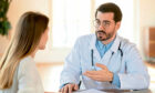Bowel cancer patient speaking with a doctor.