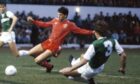 Hibs' Gordon Chisholm (left) and Ian Munro (3) fail to shut down Eric Black who breaks through to score Aberdeen's third goal in the 1985 League Cup final. Image: SNS