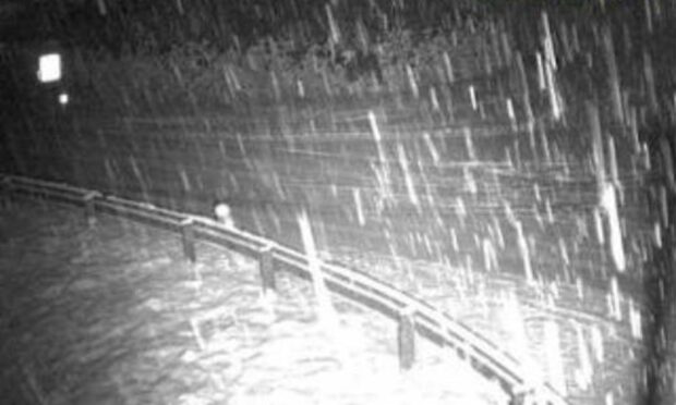 Motorists are being urged to avoid travel on the A835 Inverness to Ullapool road this evening following an evening of heavy snow showers. Image: Traffic Scotland.