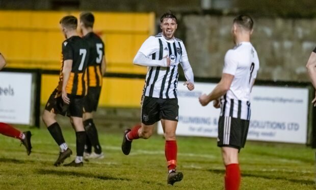 Ryan Sargent, centre, celebrates scoring for Fraserburgh against Huntly in the Aberdeenshire Shield