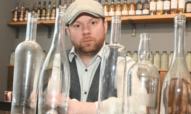 Mike Stuart, owner of Inverurie Whisky Shop 
says the new deposit return scheme will hurt businesses. Image: Chris Sumner/DC Thomson