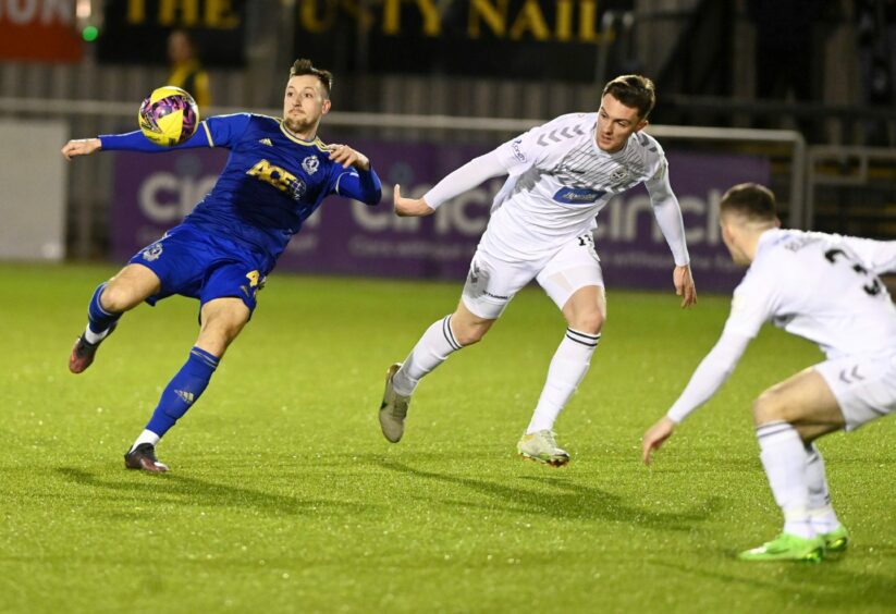 Cove Rangers midfielder Connor Scully tries to turn the ball goalwards. Image: Chris Sumner/DC Thomson