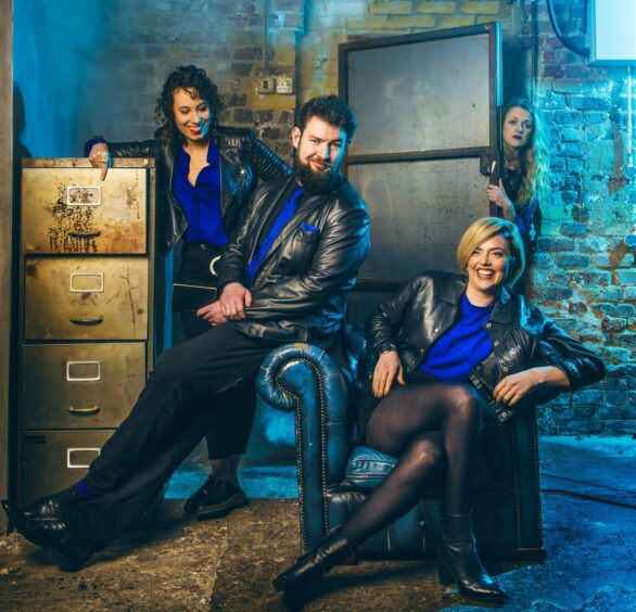 CSI: Crime Scene Improvisation the team posed in leather and blue