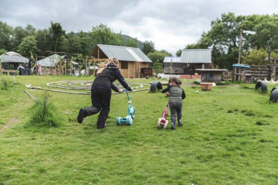 Children at play at outdoor nursery in Highlands