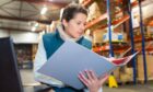 warehouse manager checks double duty charges on imports in the UK